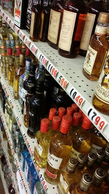 Liquor bottles arranged on shelves inside Liquor Castle